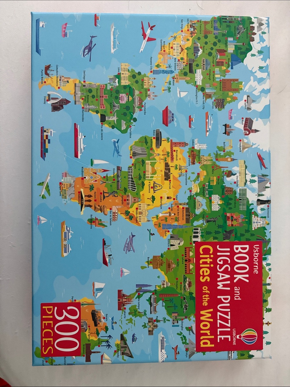 New; never opened. Usborne Cities of the World Jigsaw Puzzle & Book